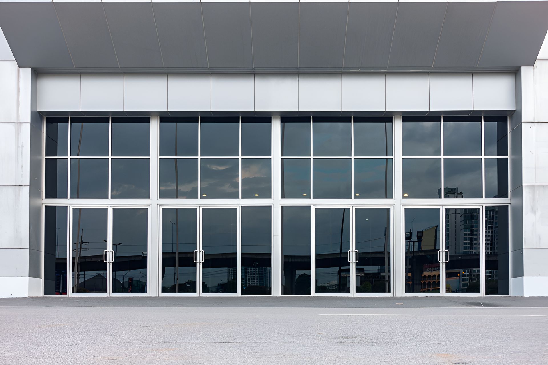 A Large Commercial Building With Glass Doors - Roo's Door & Window Maintenance, Sunshine Coast QLD