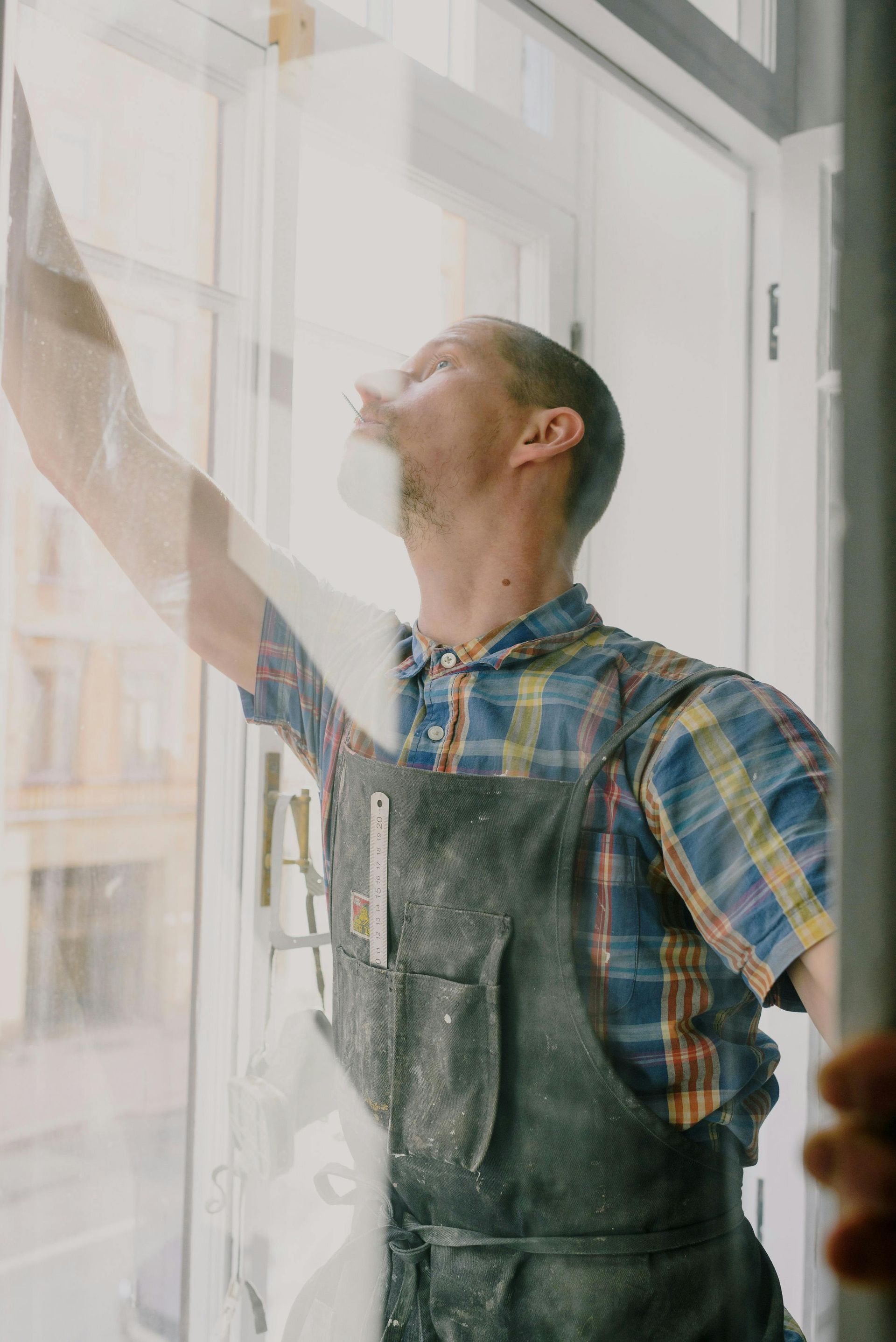 A Yellow Window With A White Frame Is On A White Wall — Roo’s Door & Window Maintenance In Caloundra, QLD