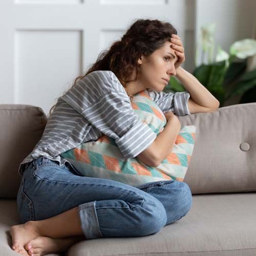 Lost in thoughts unhappy stressed woman regretting of wrong decision