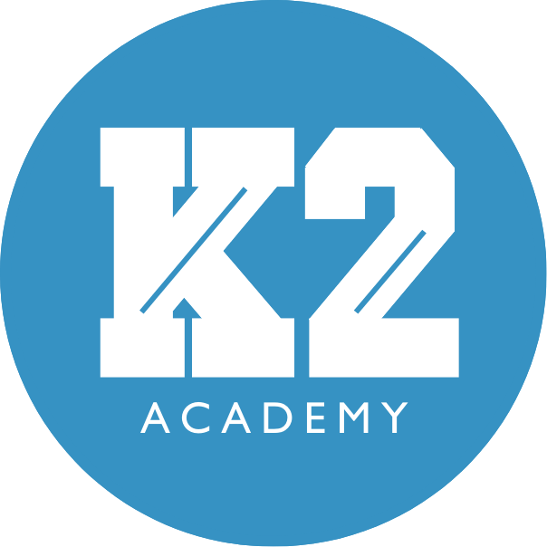 A logo for k2 gymnastics in a blue circle