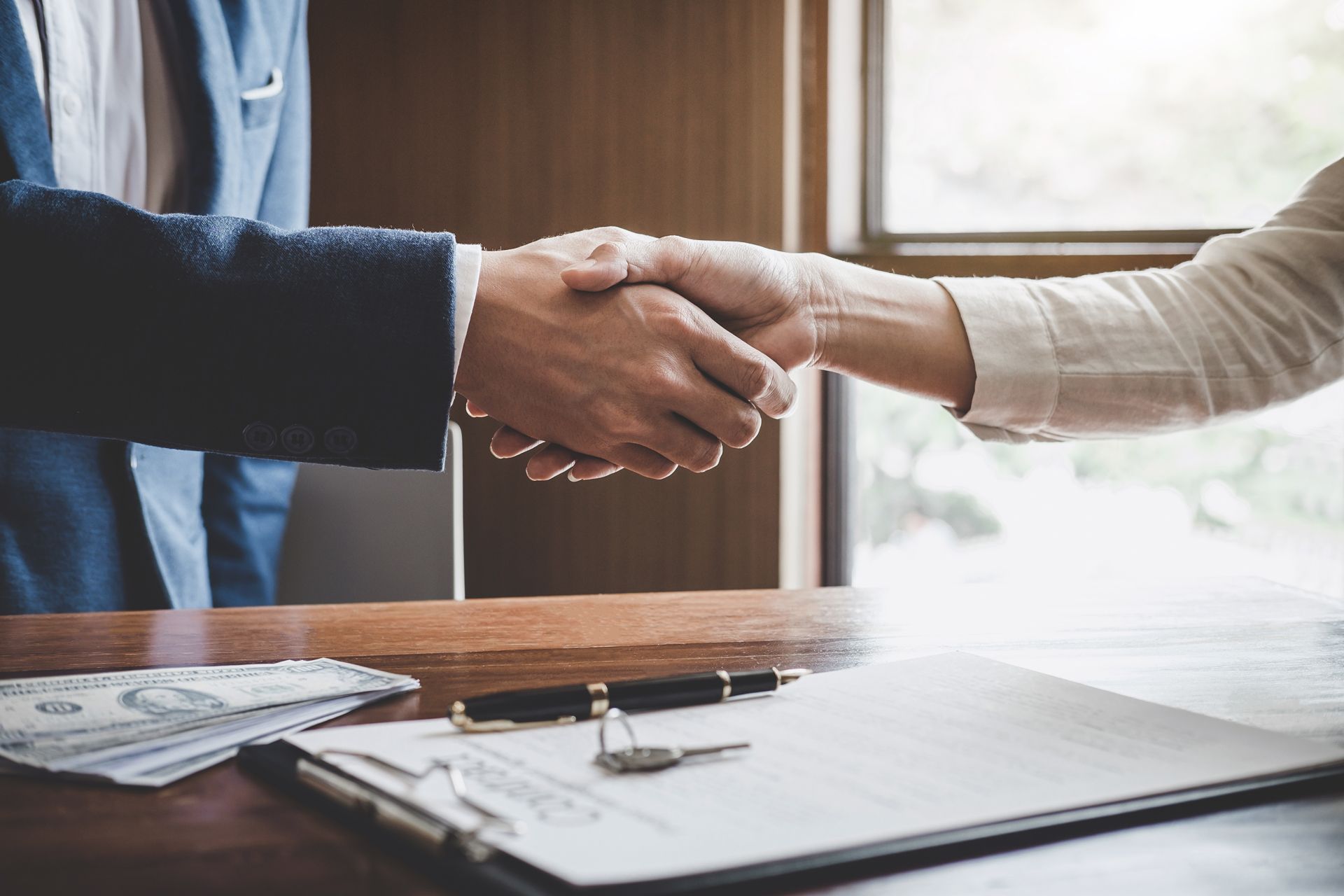 Client Shaking Hands With Agent