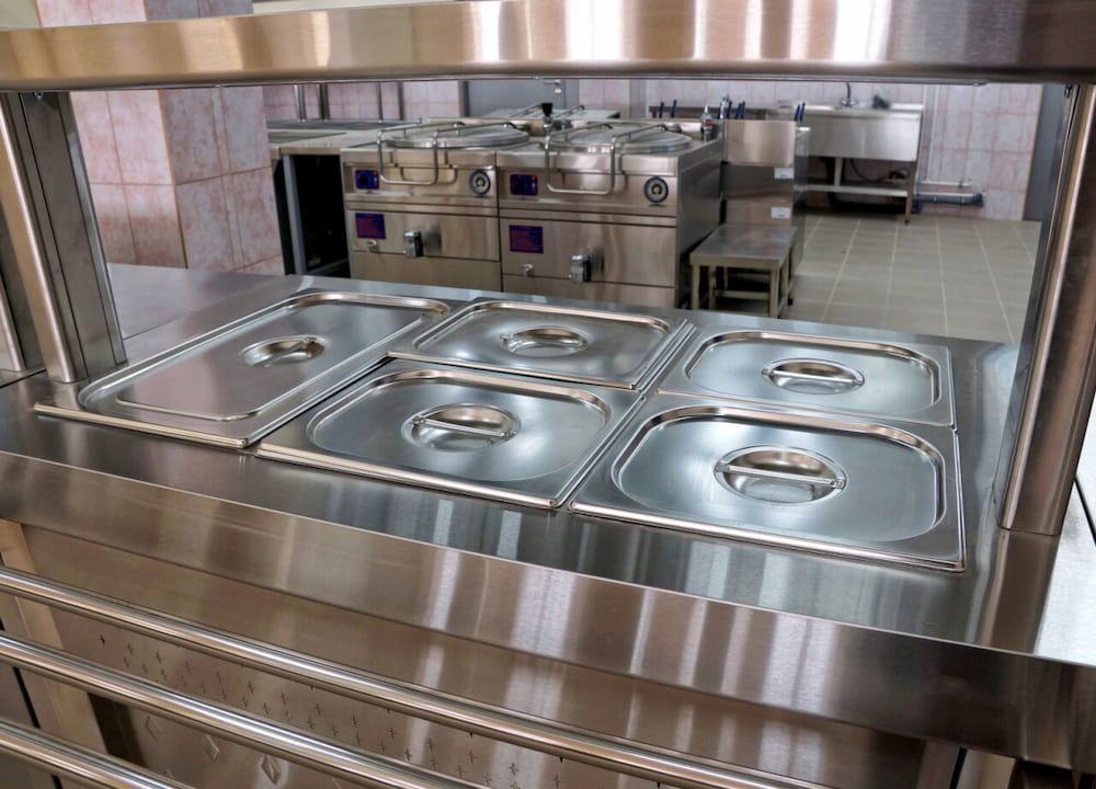 A Kitchen With Stainless Steel Appliances and Pans in It — Metaltrendz in Maroochydore, QLD