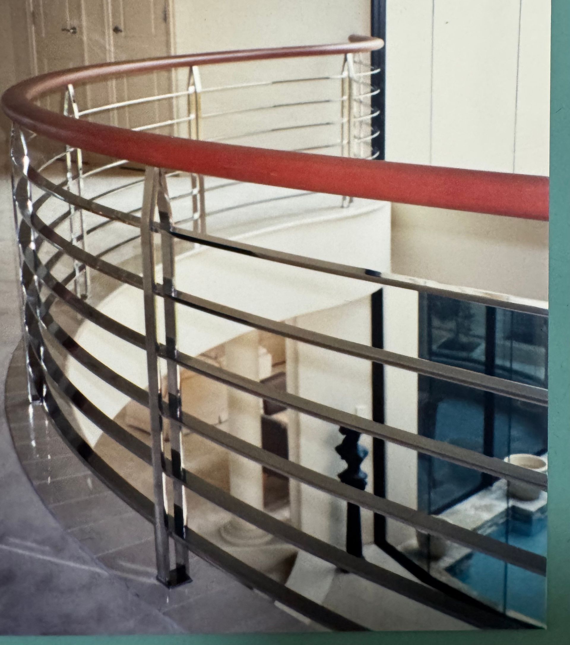Curved staircase with stainless steel railings and a wooden handrail — Metaltrendz in Kunda Park, QLD