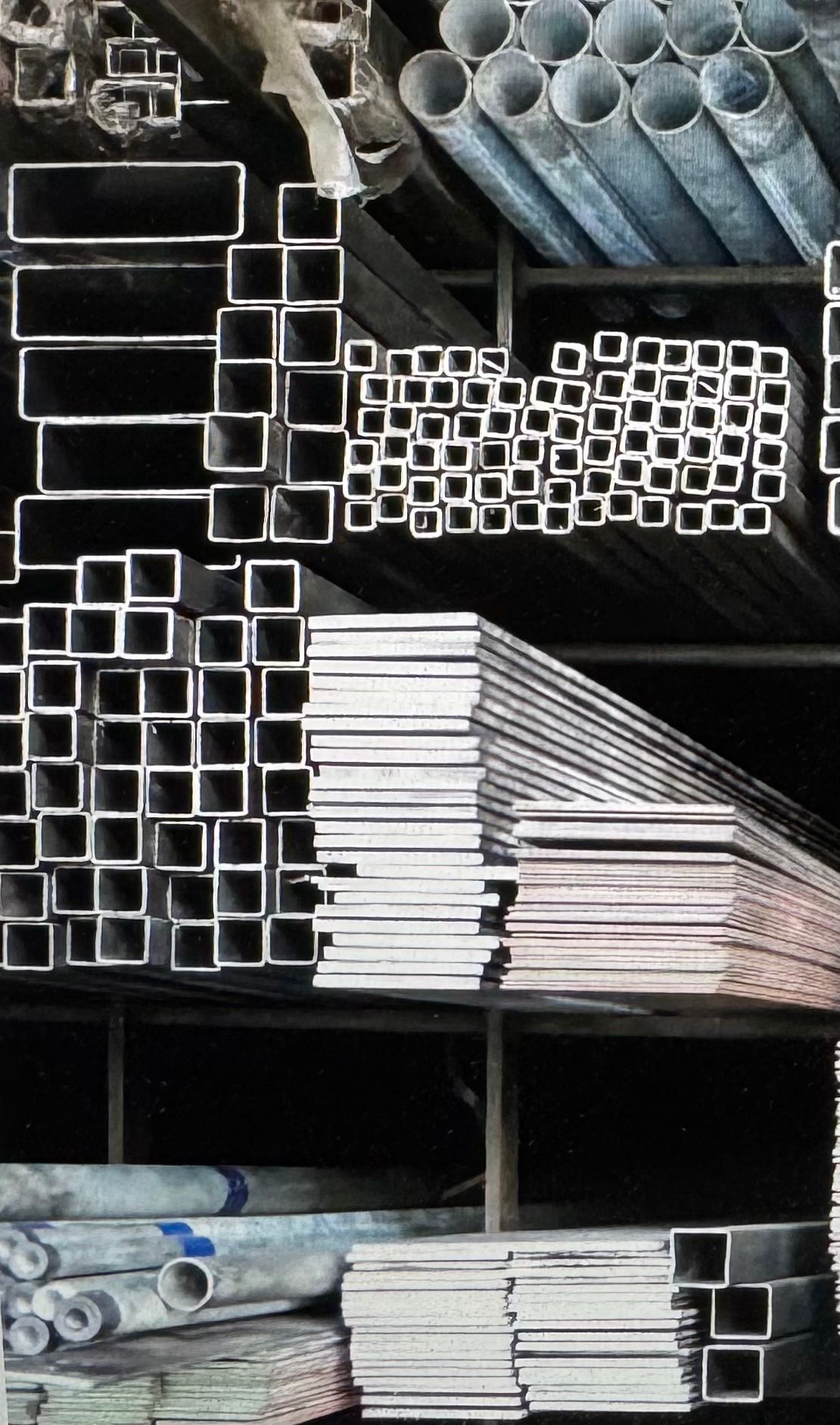 Metal rods and pipes neatly stacked on shelves in a warehouse — Metaltrendz in Kunda Park, QLD