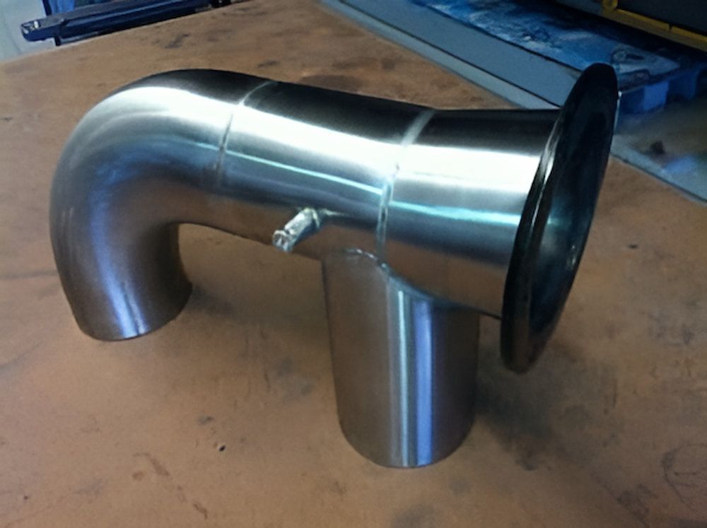 A Stainless Steel Pipe is Sitting on a Table — Metaltrendz in Kunda Park, QLD
