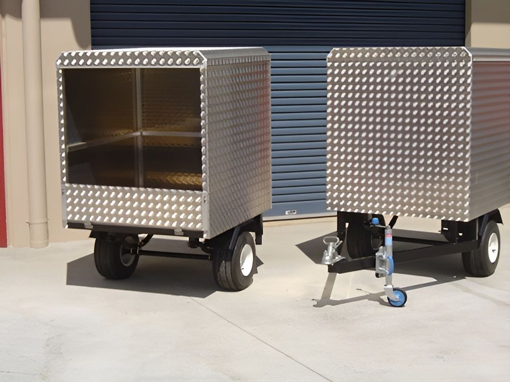 Two Stainless Steel Trailers Are Parked Next to Each Other — Metaltrendz in Kunda Park, QLD