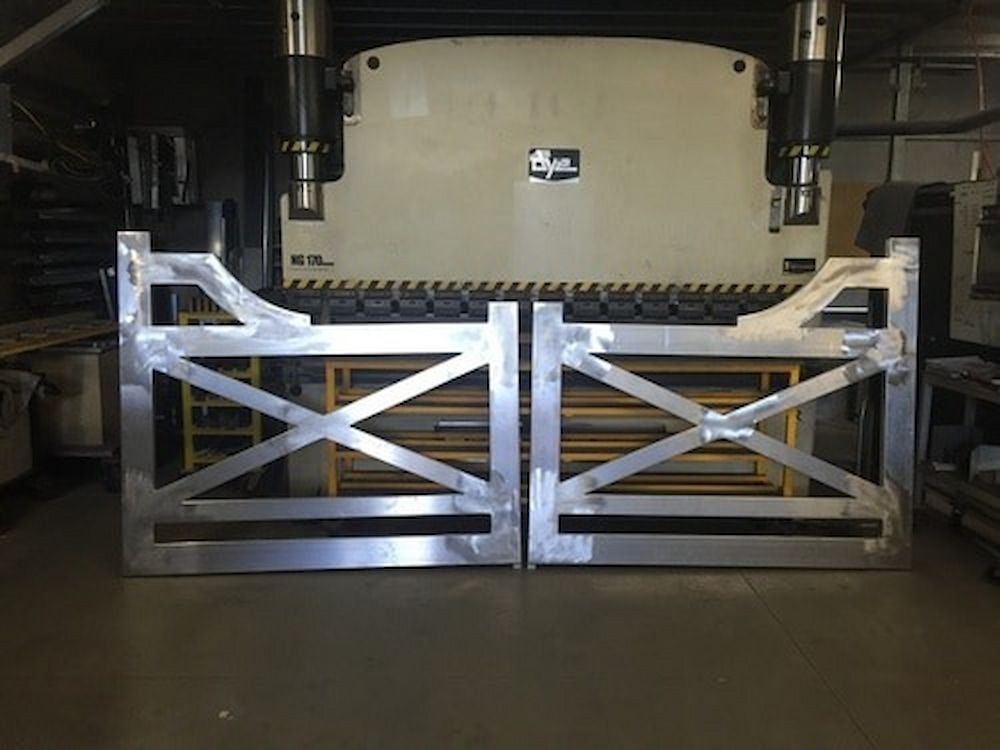 A Pair of Metal Gates Are Sitting in Front of a Machine — Metaltrendz in Kunda Park, QLD