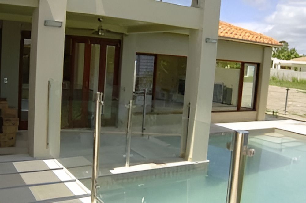 A House With a Swimming Pool in Front of It — Metaltrendz in Kunda Park, QLD