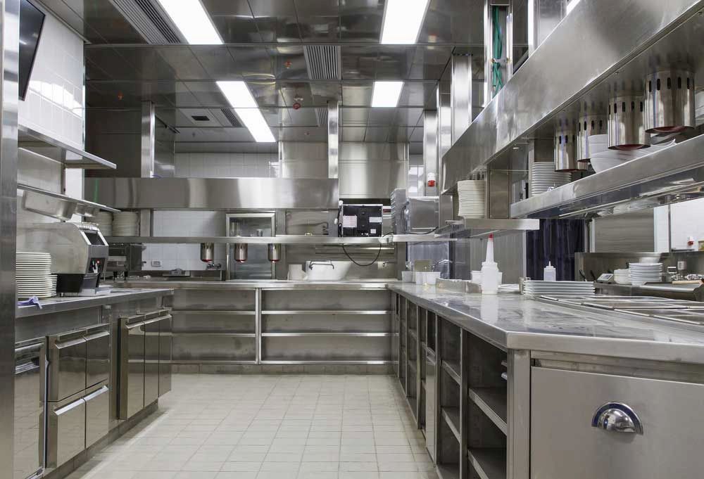 A Large Kitchen With Stainless Steel Appliances and Counter Tops — Metaltrendz in Noosa, QLD