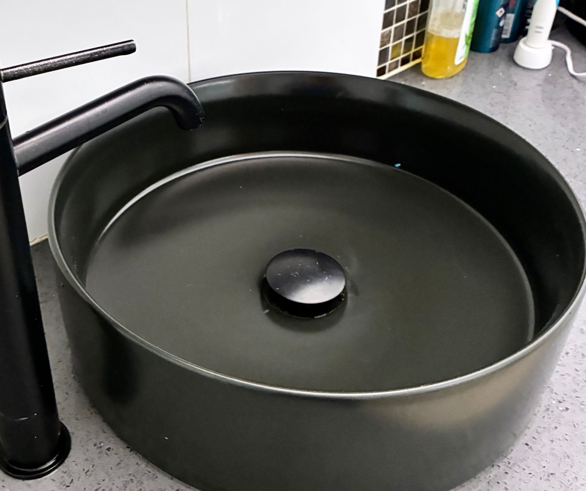 Black Round Countertop Sink With Matte Black Faucet — Schmucker Cleaning in Gulliver, QLD