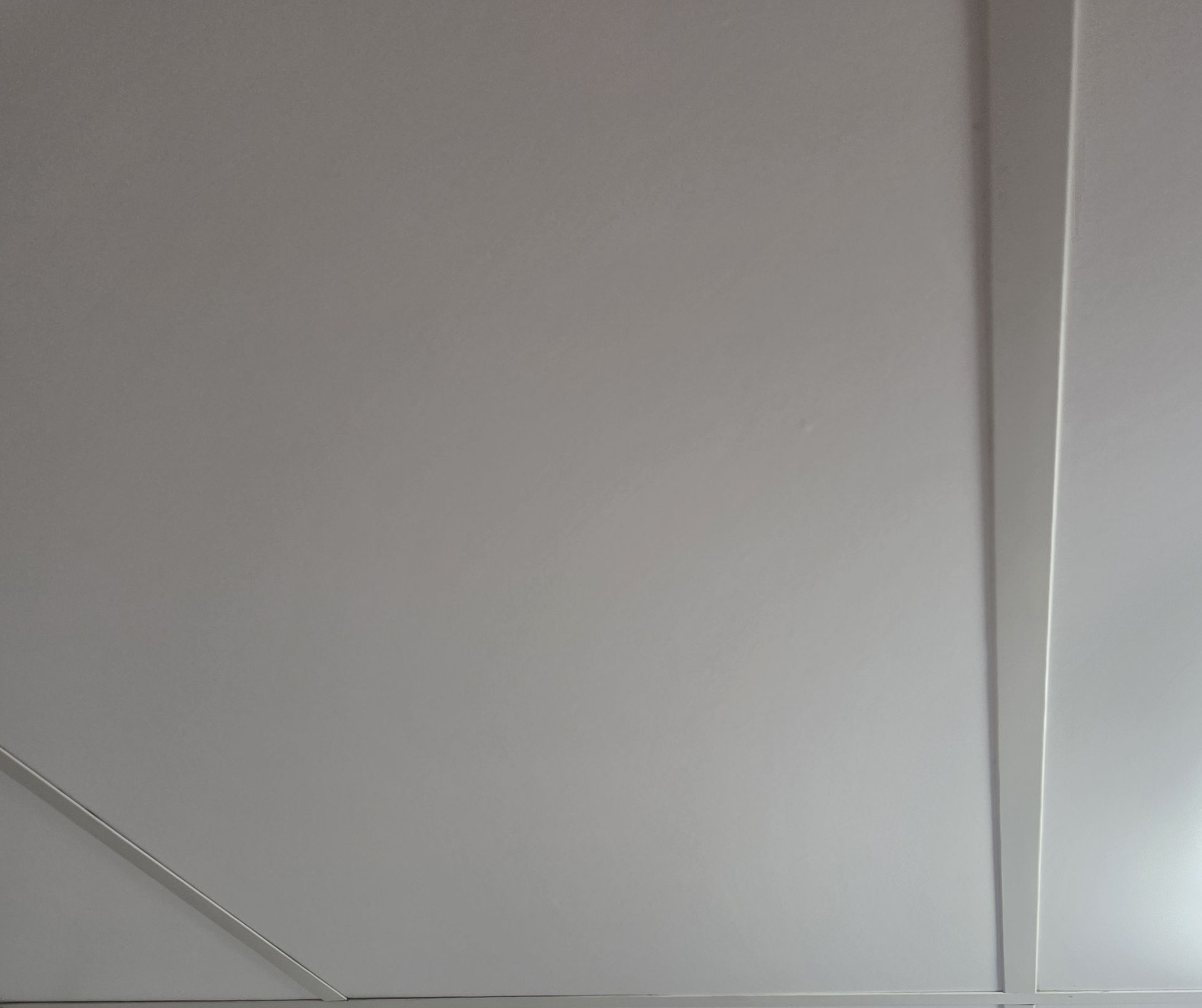 A Close-Up of A White Ceiling Featuring a Panel Seam — Schmucker Cleaning in Gulliver, QLD