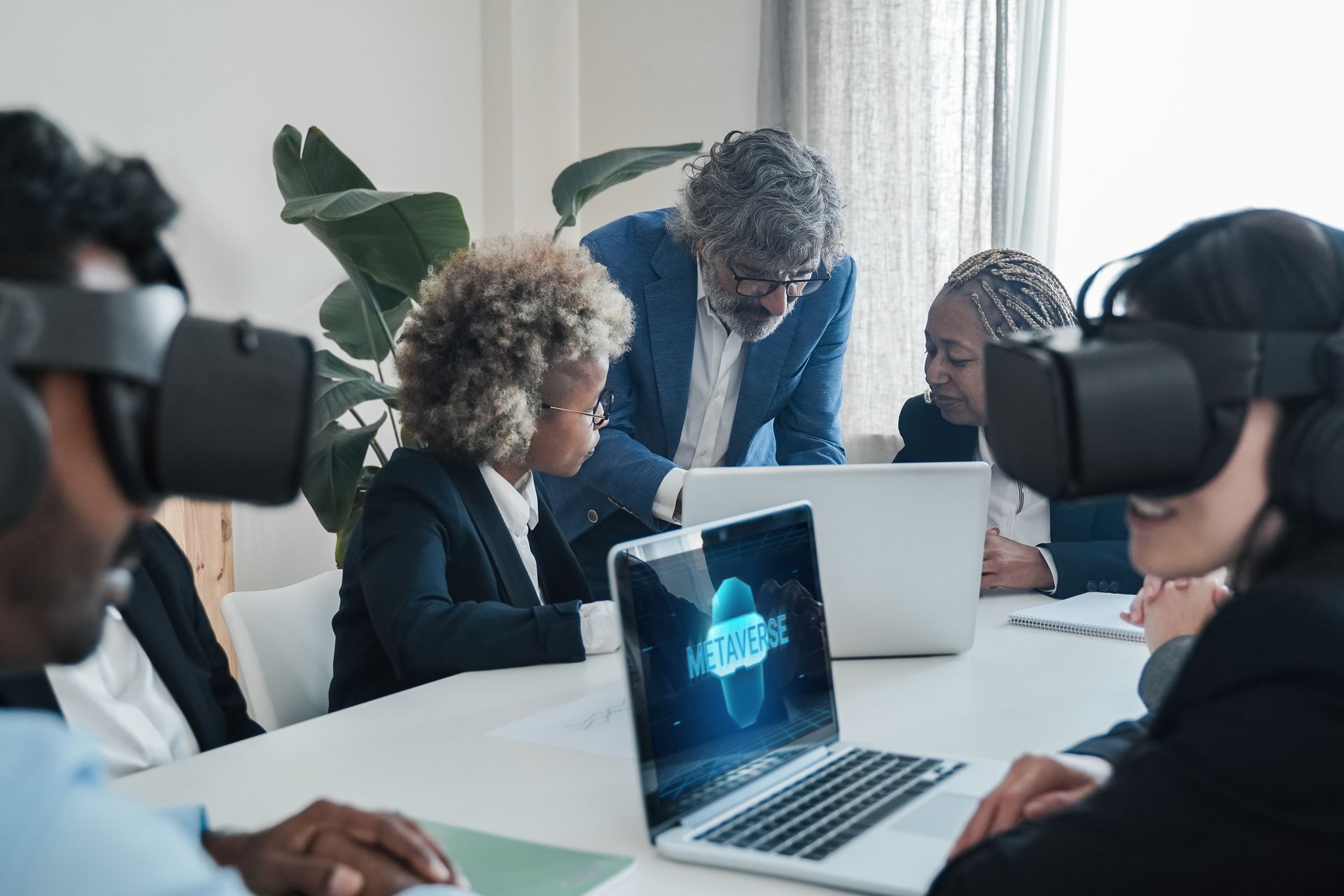 Multiracial business people using virtual reality goggles work in metaverse tech - VR lifestyle