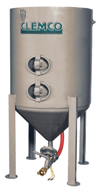 Stainless steel industrial hopper tank with valves and red hose on tripod stand
