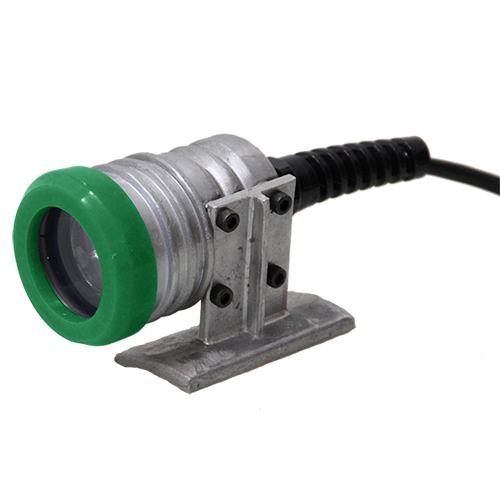 Metal sensor with green-ringed lens on a small stand, attached to a black cable