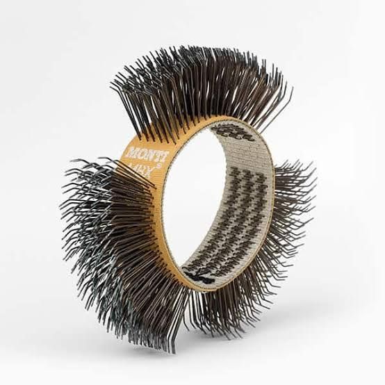 Round bristle hair styling brush with black bristles and beige handle on a white background