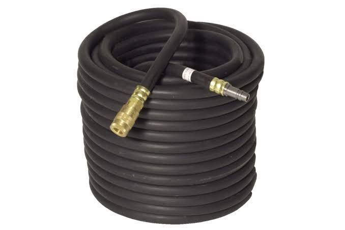 Coiled black hose with brass fittings on a white background