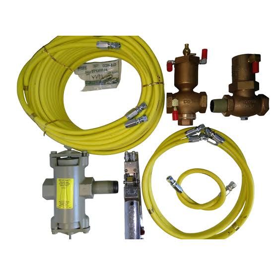 Yellow hoses and brass gas valves with gray regulators, arranged on a white background