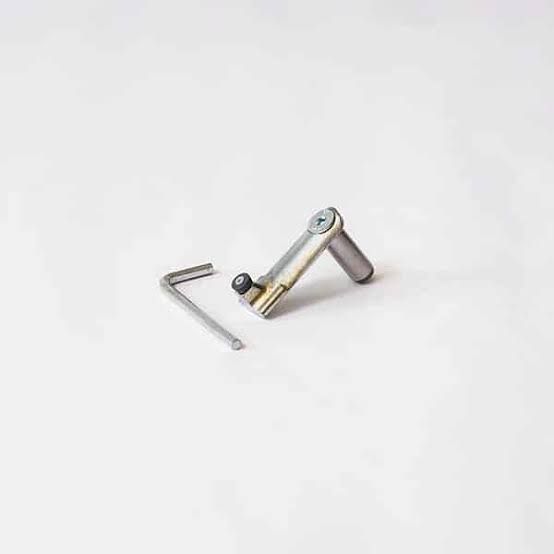 Small silver metal hand tool with an Allen key on a white background