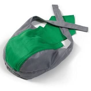 Green and gray drawstring bag with crossed straps on a white background