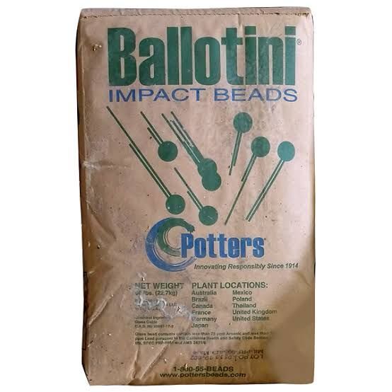 Brown bag of Ballotin Impact Beads with green bead graphics and Cotters branding