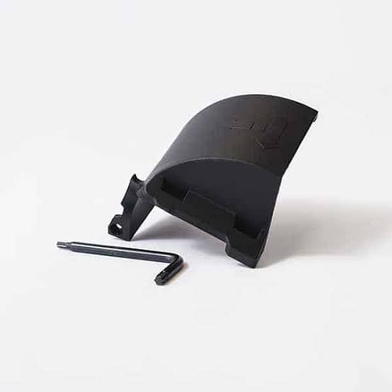 Black plastic clip with a small L-shaped metal hex key on a white background