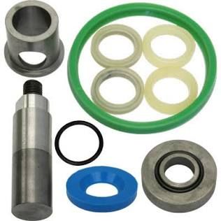 Assorted mechanical parts and seals, including green, blue, black, and metal rings on white background