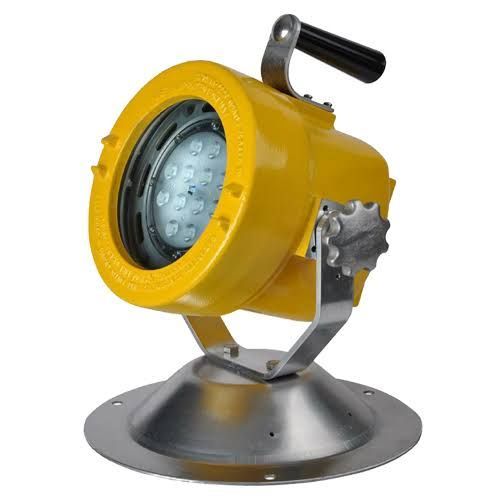 Yellow industrial spotlight on a silver base with a black handle and clear front lens.