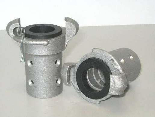 Two metallic cable connectors, one upright and one lying on its side, on a white background