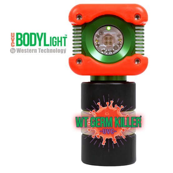 Green and orange WT Body Light germ killer device with black base and circular center lens