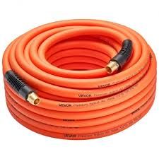 Coiled orange air hose with black connectors on a white background