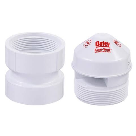White plastic vent caps, one showing threads and one labeled