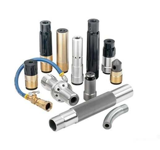 Assorted metal cylindrical machine parts in silver, black, gold, and gray on a white background