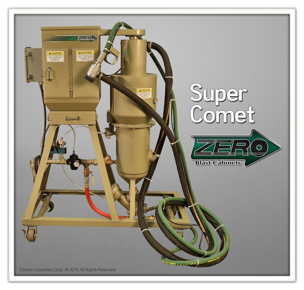Beige industrial blast cabinet with hoses and frame, labeled “Super Comet Zero” on gray background