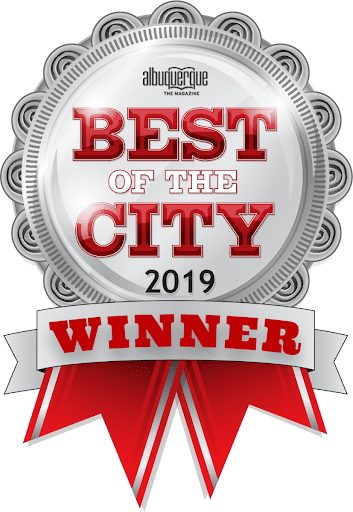 a silver badge that says best of the city 2019 winner