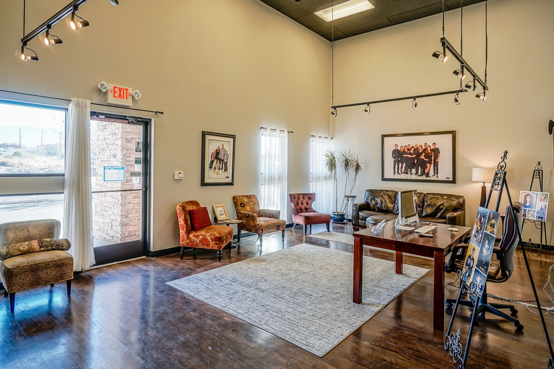 a freshly painted office with a table , chairs , and a couch .