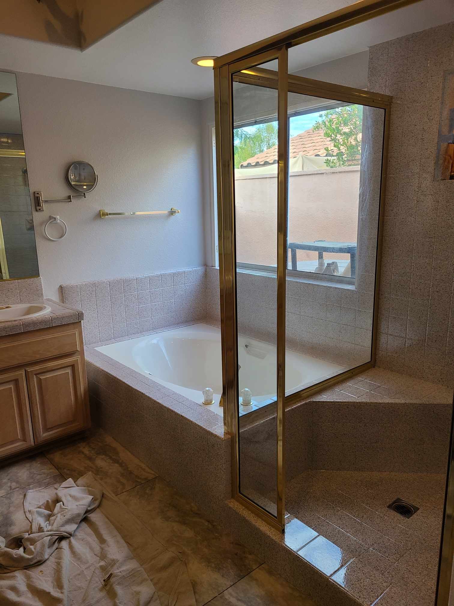Image of a tub and shower that was refinshed. You can see a bathtub with a shower next to each other.