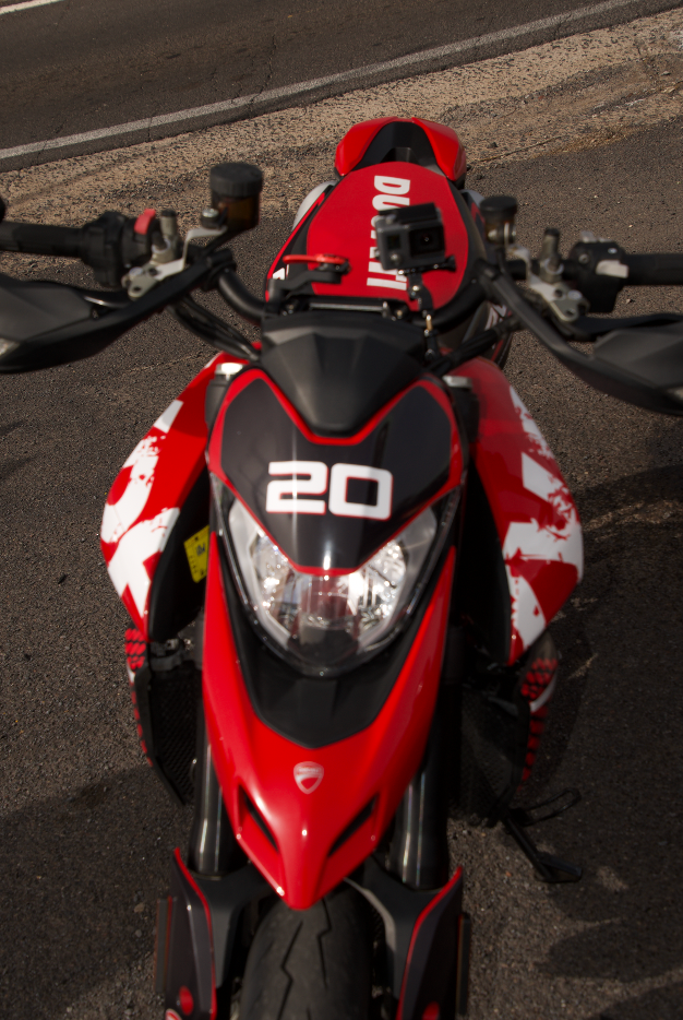A red motorcycle with the number 20 on the front