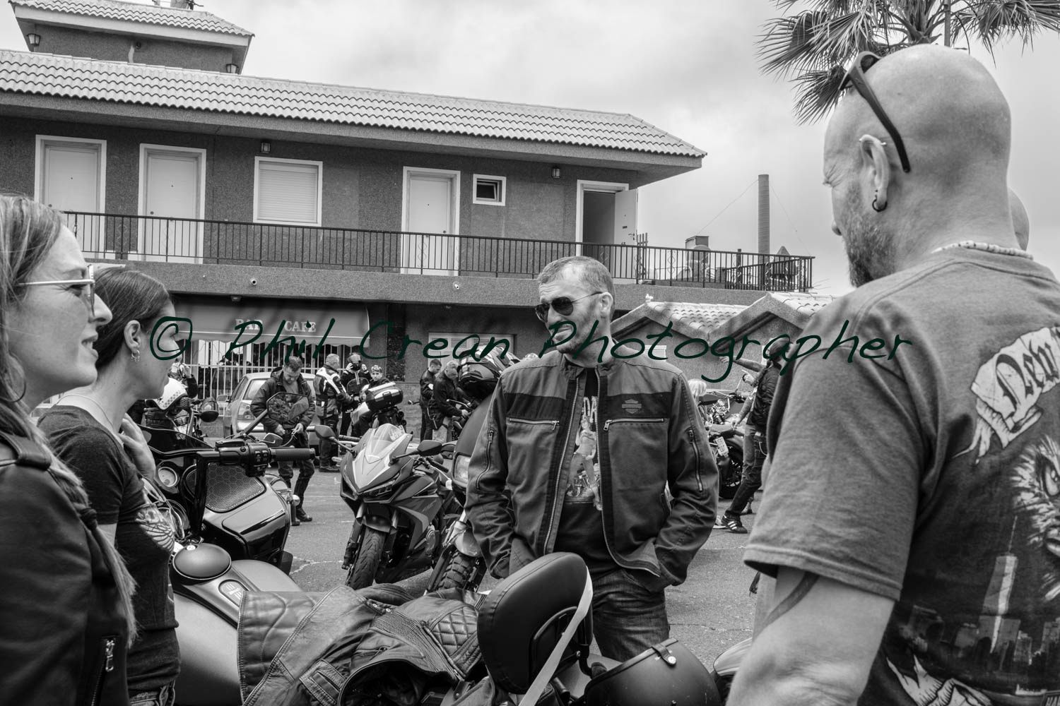 A man wearing a shirt that says ' biker ' on it