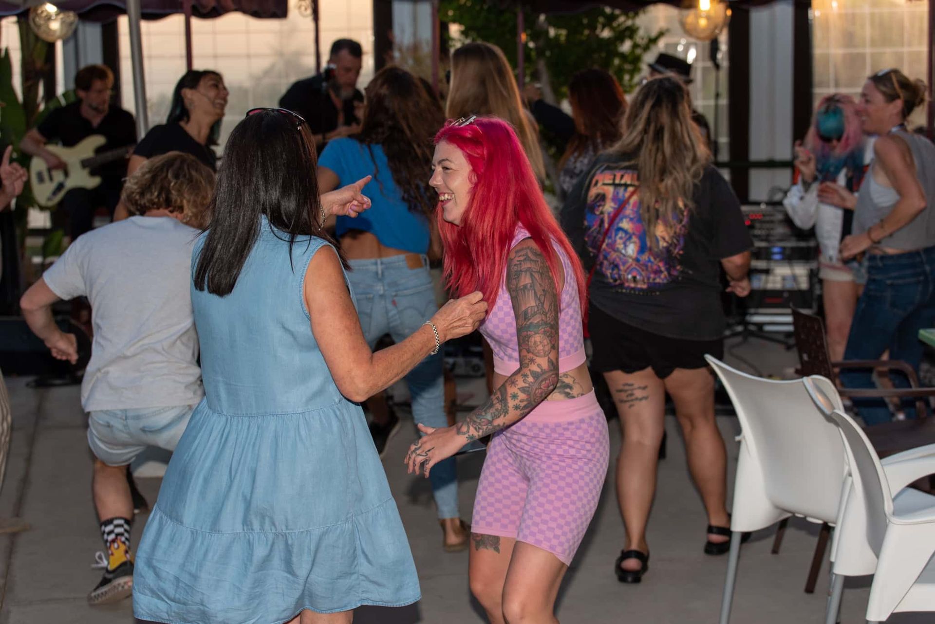 A group of people are dancing at a party.