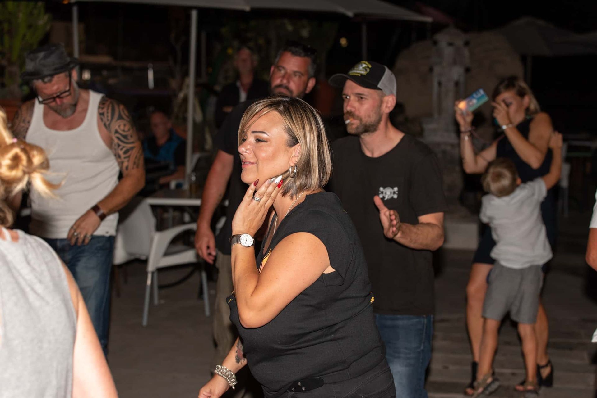 A group of people are dancing at a party.
