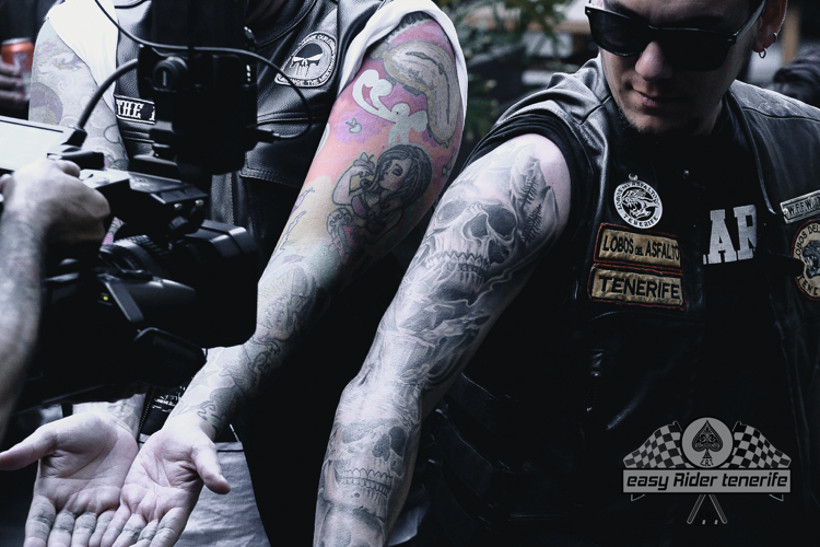 A man with a tattoo on his arm that says ap