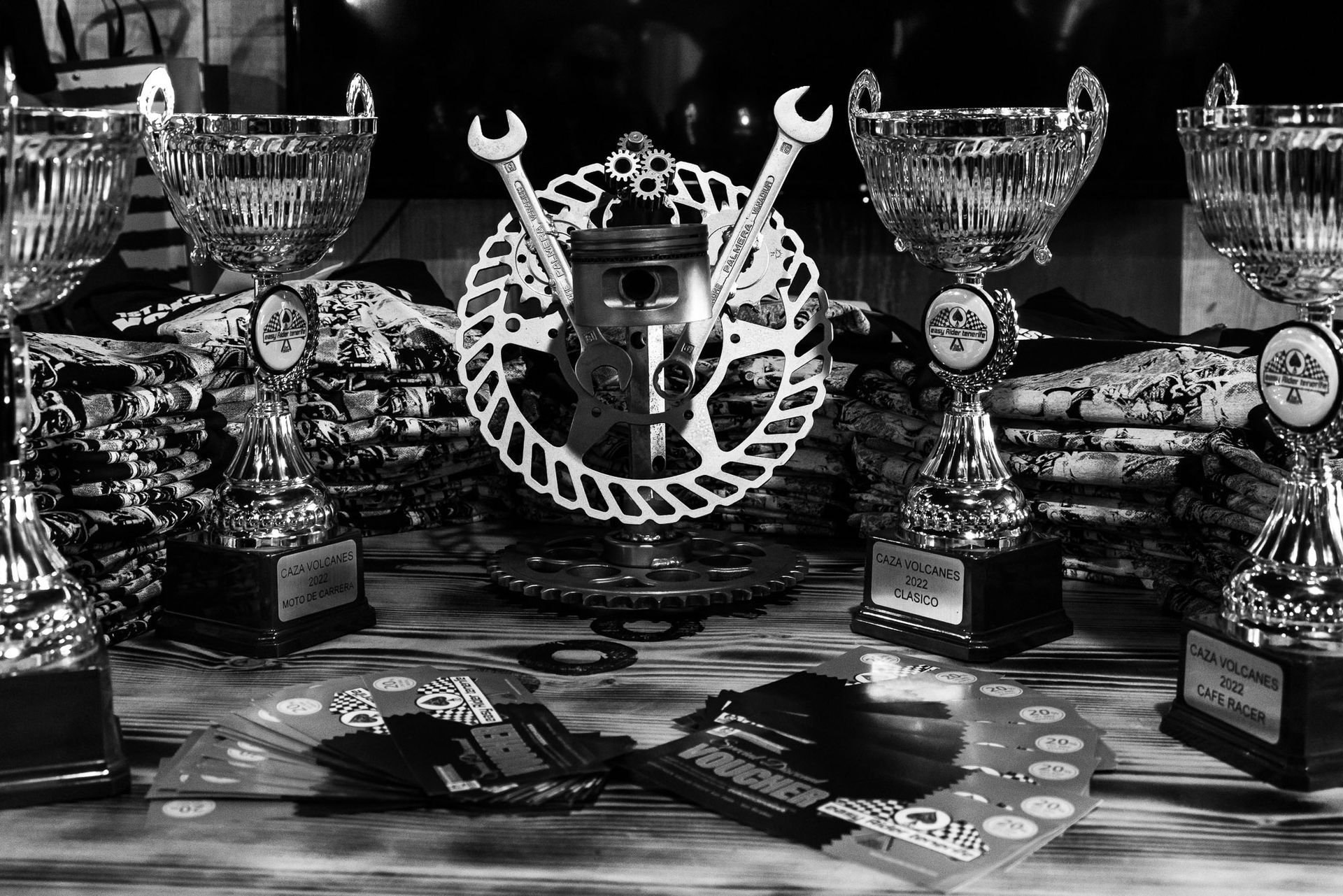 A black and white photo of trophies on a table