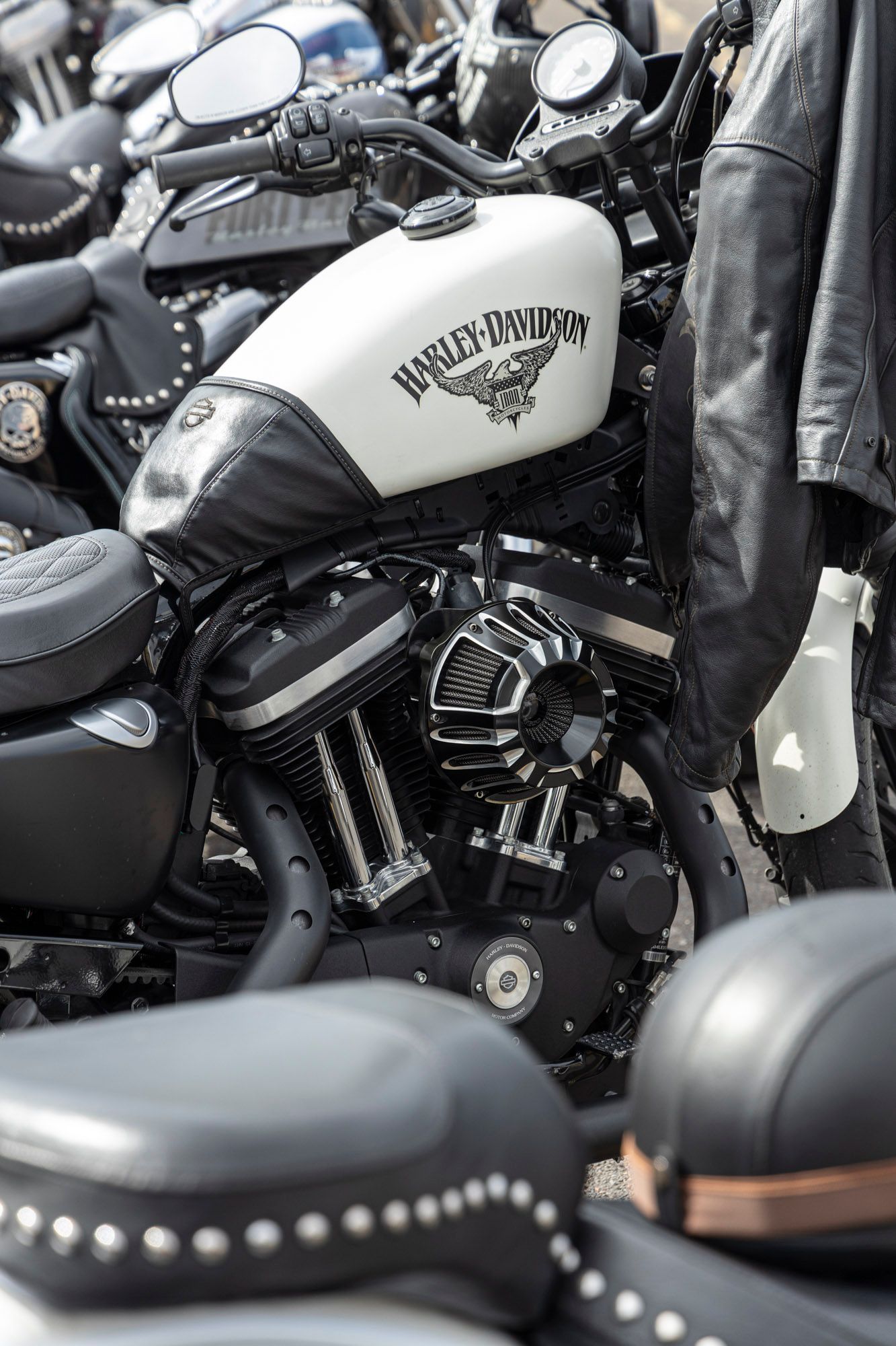 A row of harley davidson motorcycles are parked next to each other.