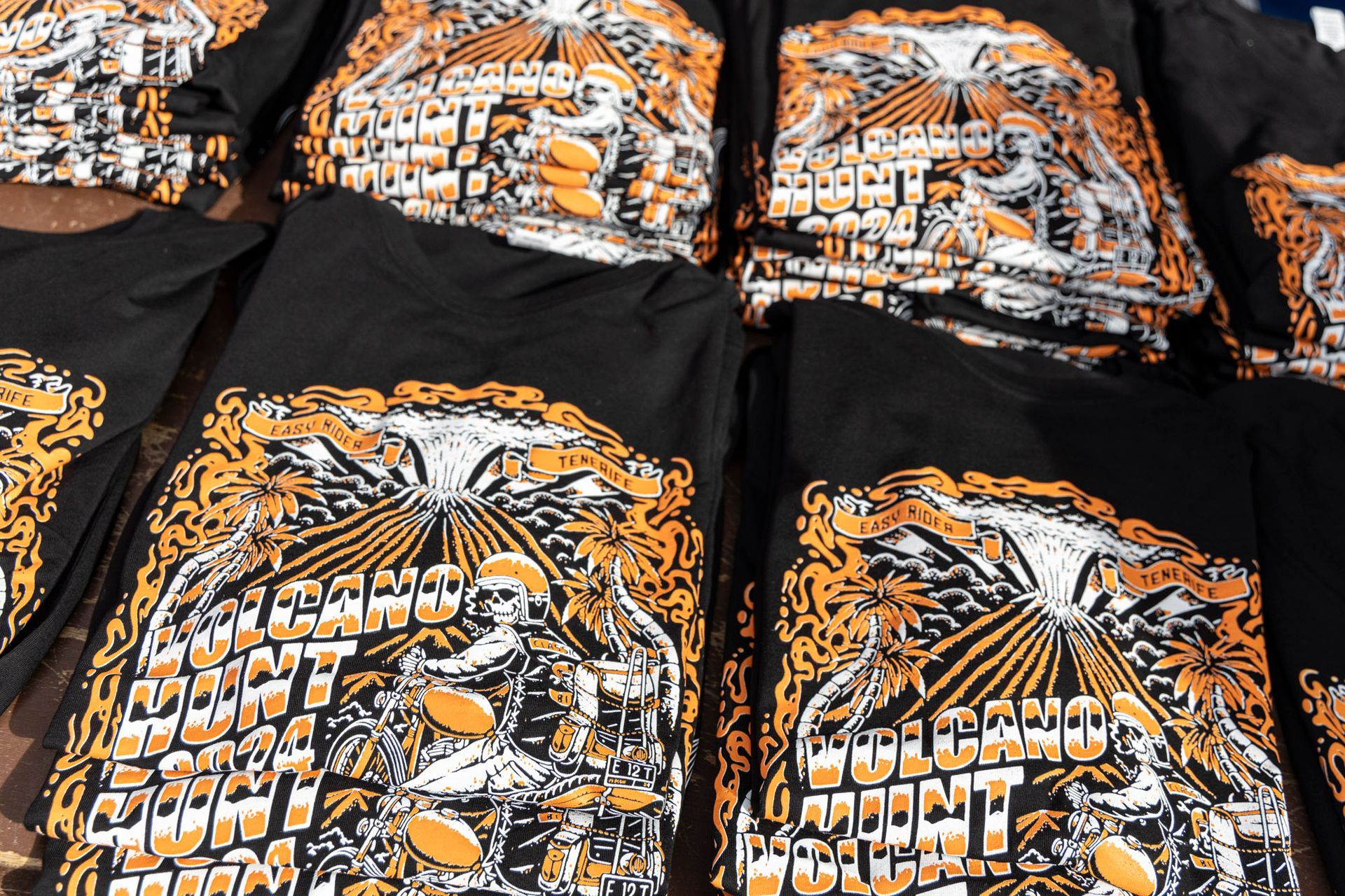 A bunch of black shirts with a tiger on them