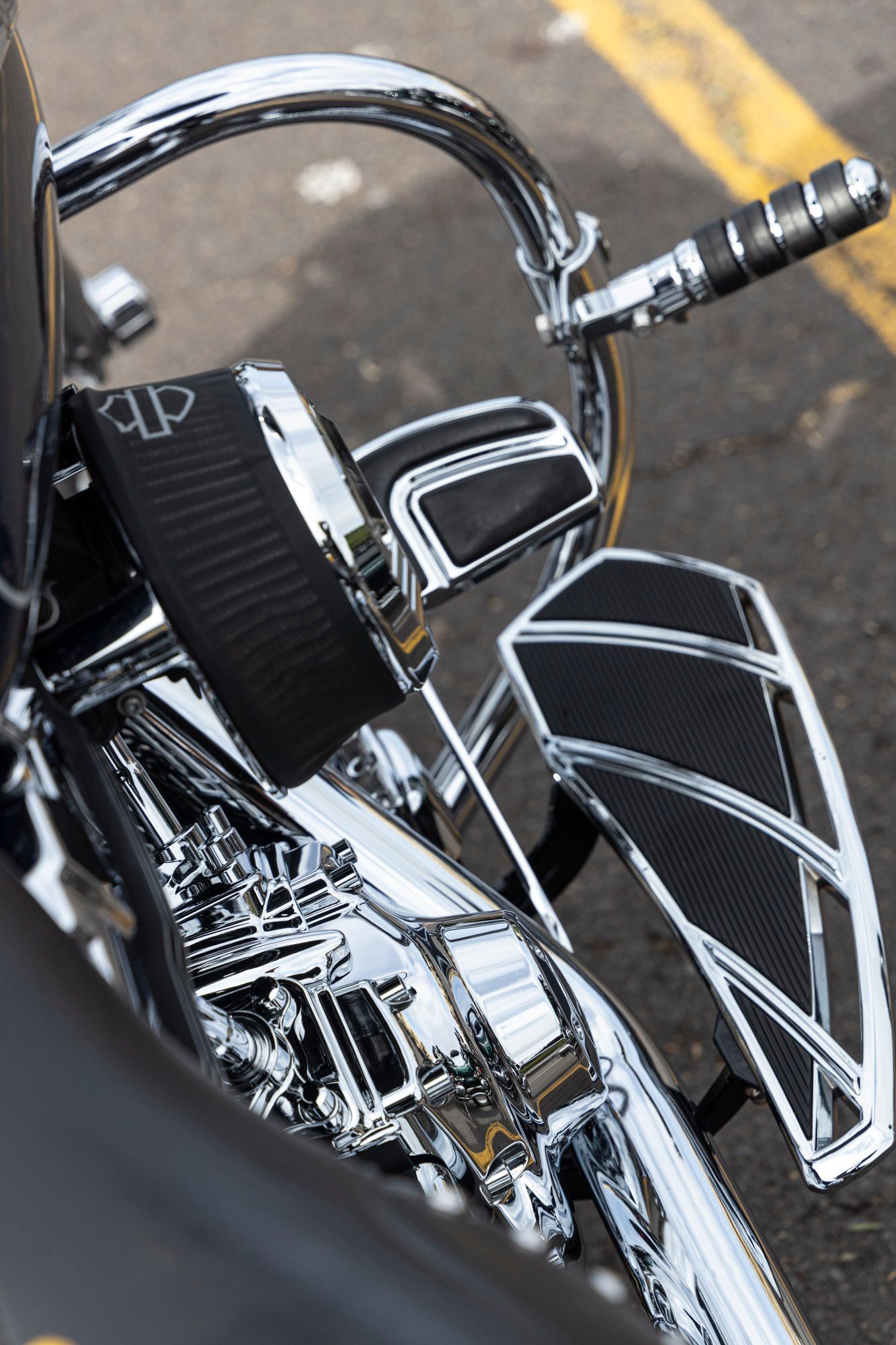 A motorcycle is parked on the side of the road.