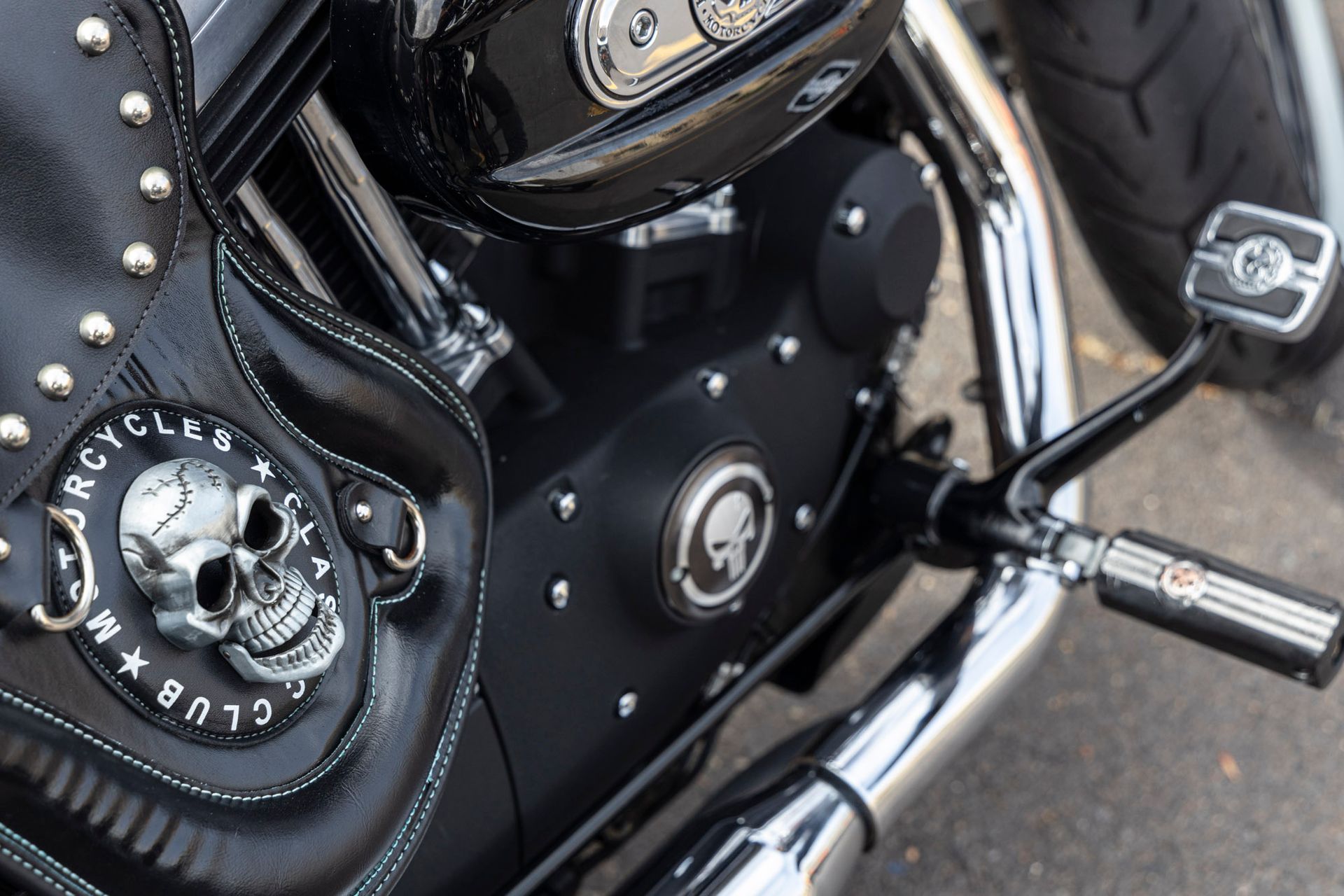 A close up of a motorcycle engine with a skull on it