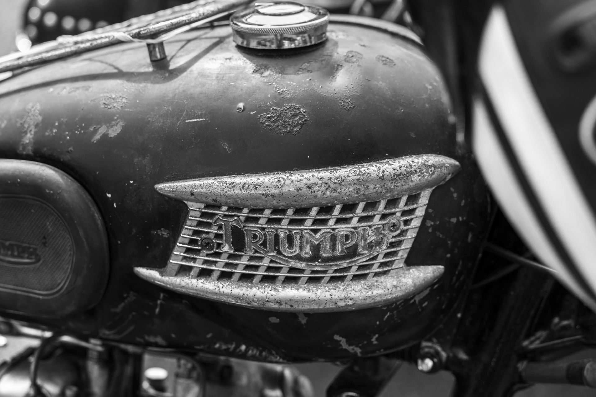 A black and white photo of a triumph motorcycle