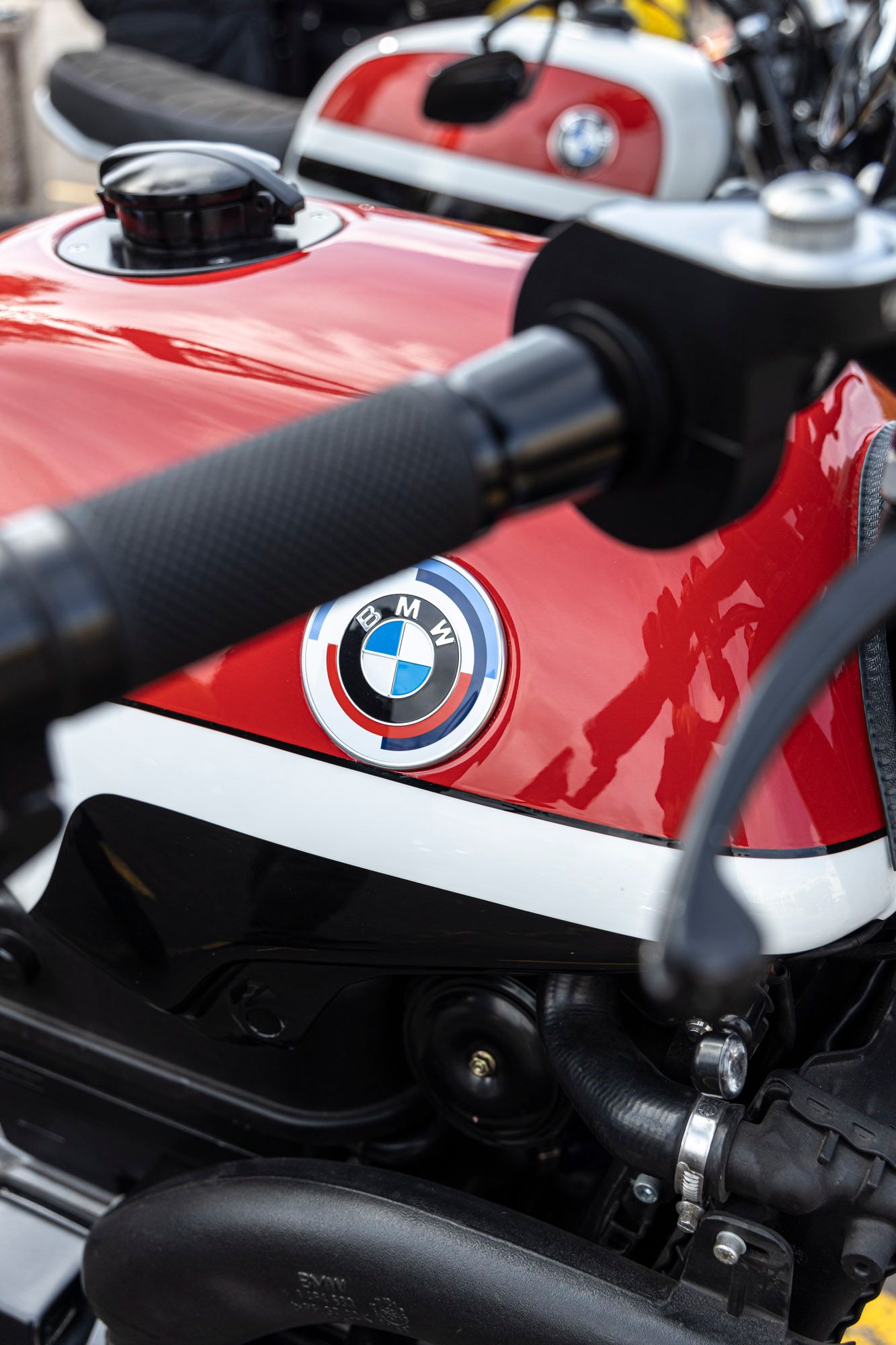 A red motorcycle with a bmw logo on the tank