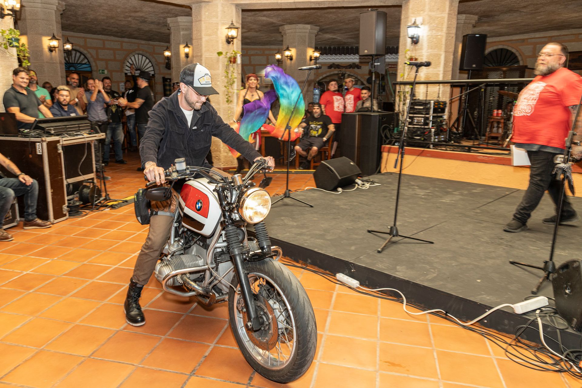 A man is riding a motorcycle on a stage.