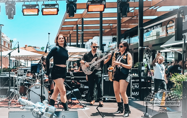 A group of people are playing instruments on a stage.